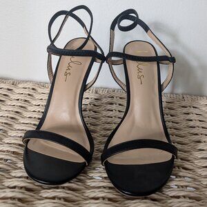 Black strappy high heels